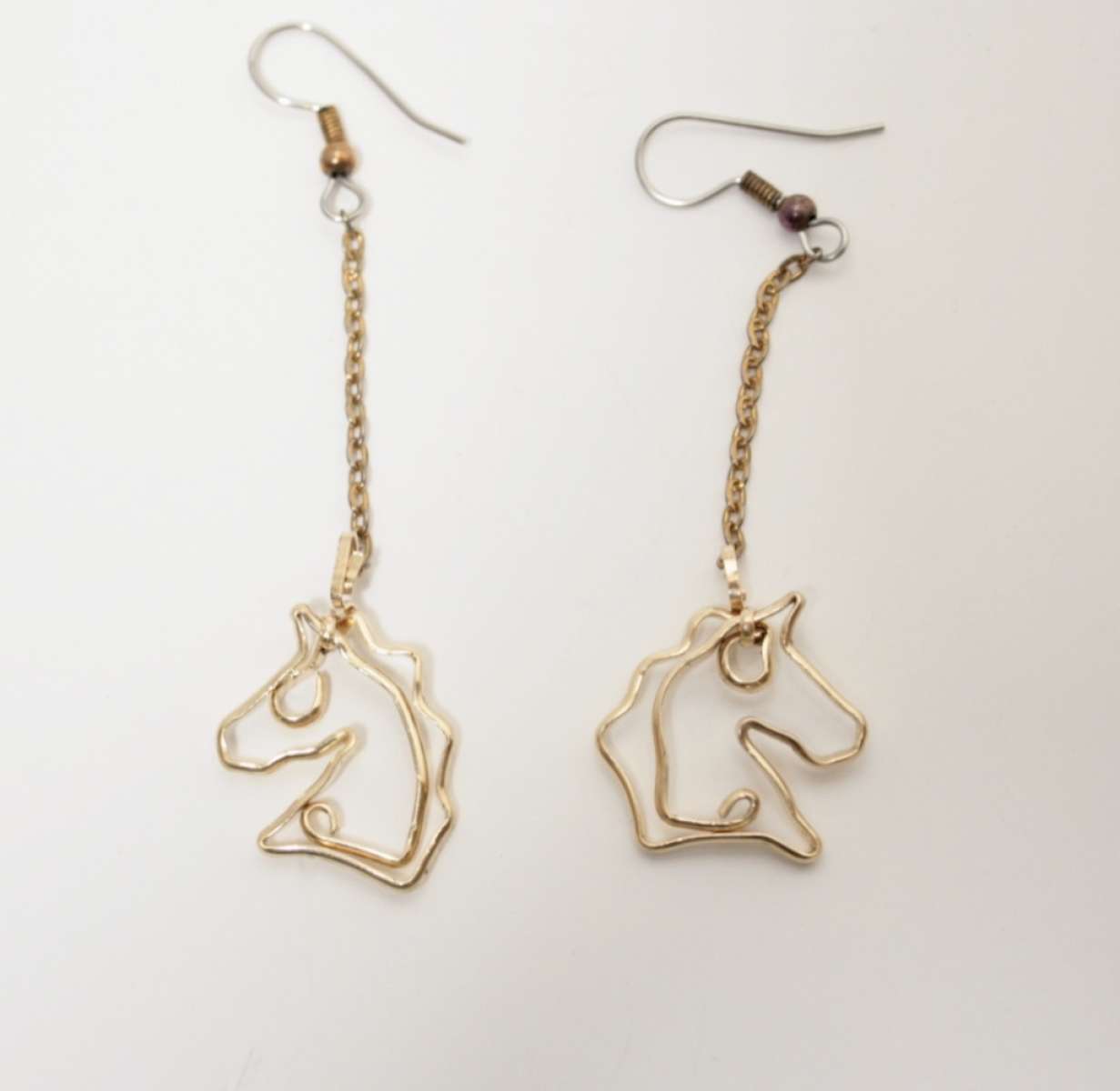 Horse heads on chain with surgical steel ear wire